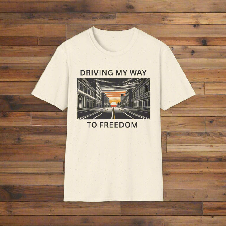 Beige t-shirt with a graphic design and text on a white background that says driving my way to freedom