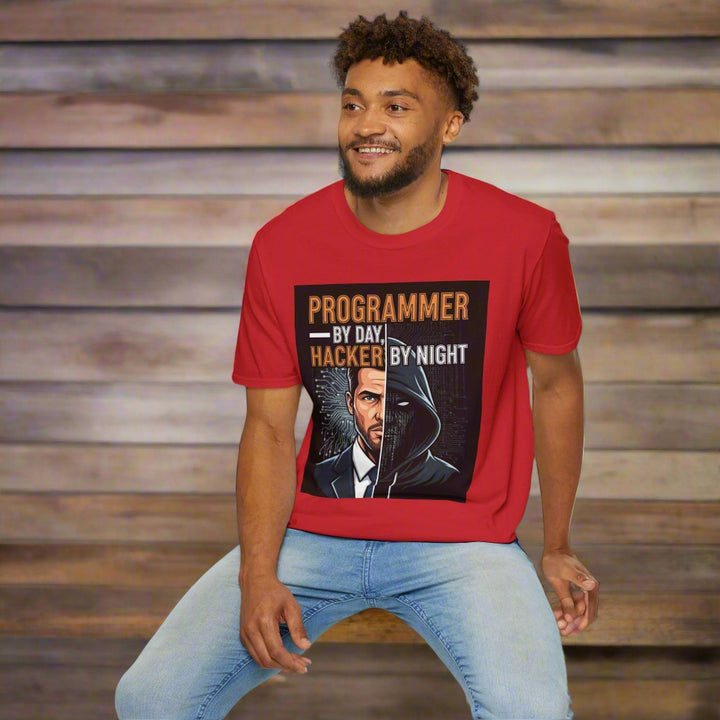 Man wearing a red t-shirt with a graphic and text 'Programmer by day, Hacker by night'.