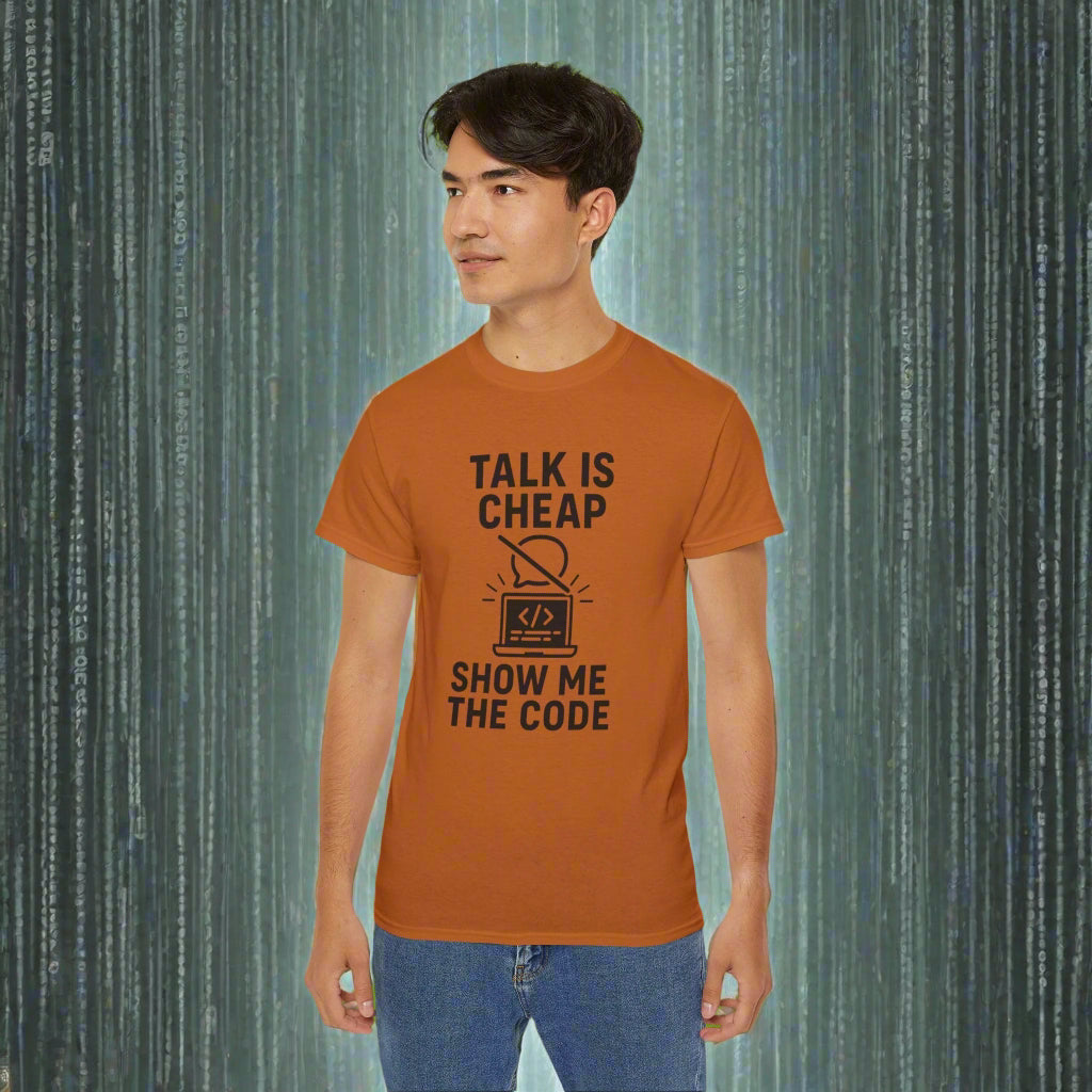 Person wearing an orange t-shirt with 'Talk is cheap, show me the code' text on a white background